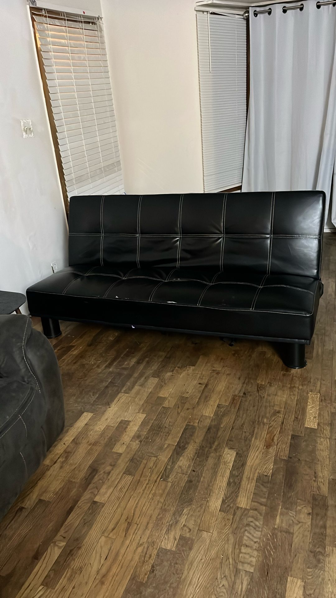 Black Faux Leather Tufted Futon Sofa Bed