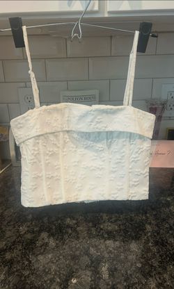 White top with floral embroidery