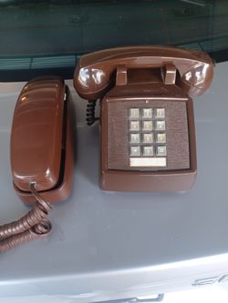 Phones one att  one itt phones Brown .