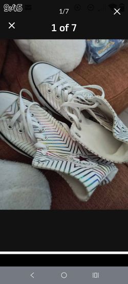 This is a Converse Chuck Taylor All Star High Metallic Exploding Star sneaker in white with a metallic rainbow geometric pattern. Women's! Size 10
