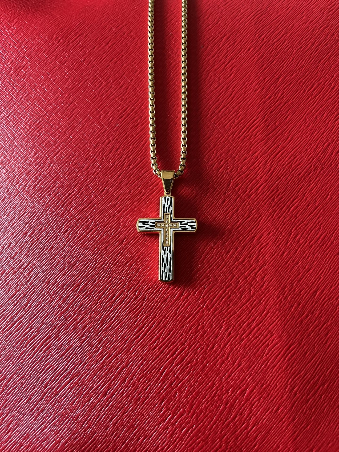 Stainless steel cross pendant with chain.