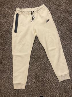 Beige Nike tech pants small