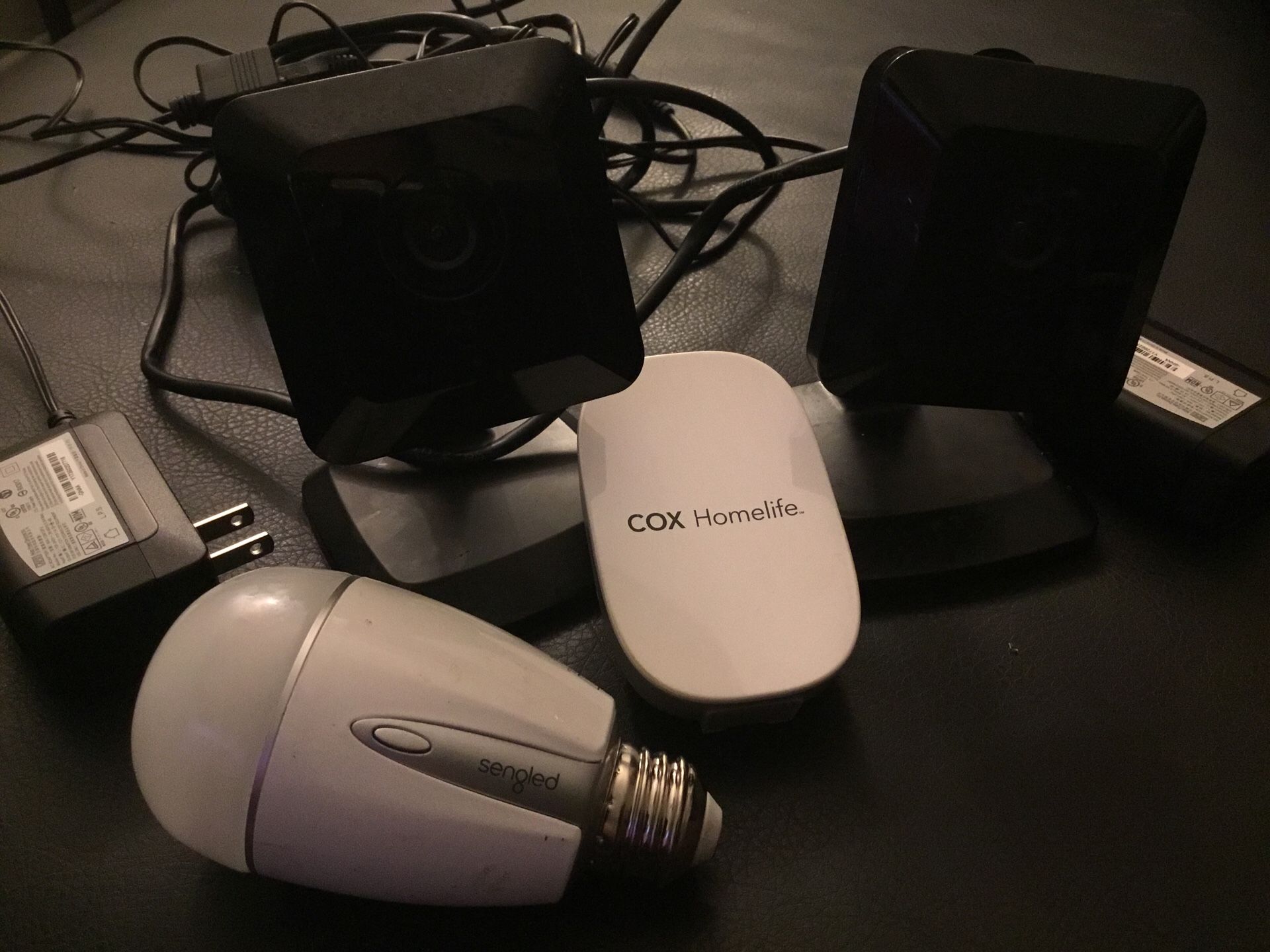 Cox Homelife Cameras for Cox contour home security system , and Cox home-life Plug in and Lightbulb to access on app to turn on and off and dim Iight