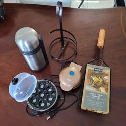 Paper Towel Holder, Egg Cooker, Waffle Maker, Coffee Thurmos, and Bar- B- Q Grill Basket.