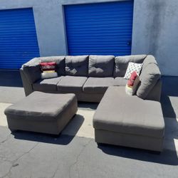 Beautiful sectional couch gray with ottoman, very clean