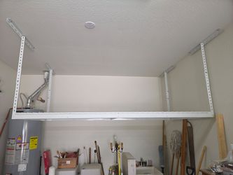 SafeRacks adjustable height 4'×8' ceiling storage rack.