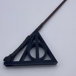 Harry Potter Deathly Hallows 3D Printed Wand Stand Fits Most Wands WAND NOT INCLUDED   The wand in the picture is from Universal Studios   Can print i