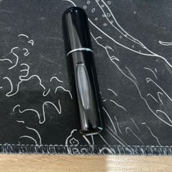 black 5ml travel sized cologne bottle