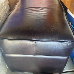 Padded dark brown bench with storage