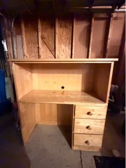 Selling a light maple wood student desk with built-in hutch. Features an open upper shelf for storage, 3 side drawers with wood knobs, a cable managem