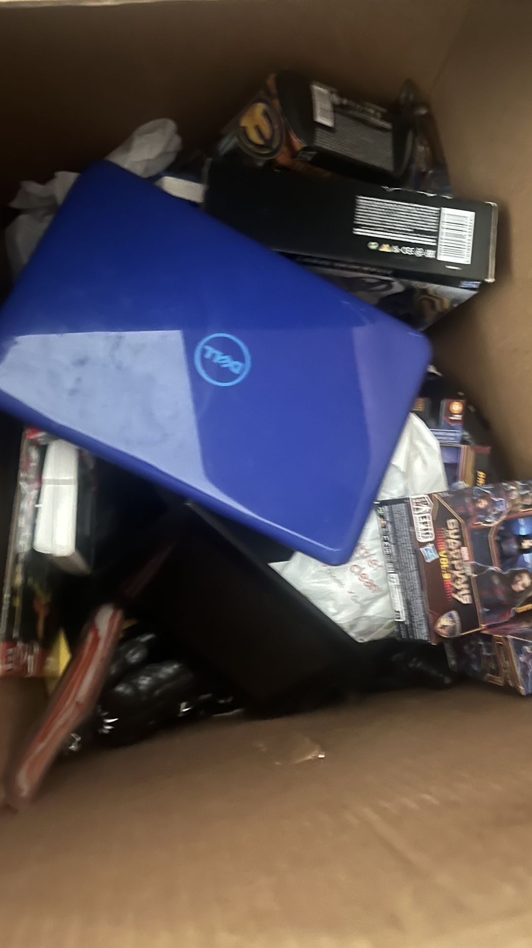 Box Full Of Action Figures Laptop And Tablet