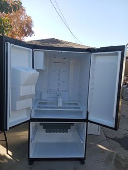 Samsung refrigerator in excellent condition look like new everything work ice machine delivery installation available 30 days guarantee $800 with