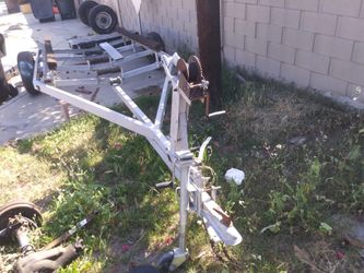 Single axle boat trailer with tilt action