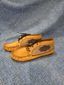 Minnetonka El Paso ankle boots  an Aztec geometric fabric pattern on brown suede.
