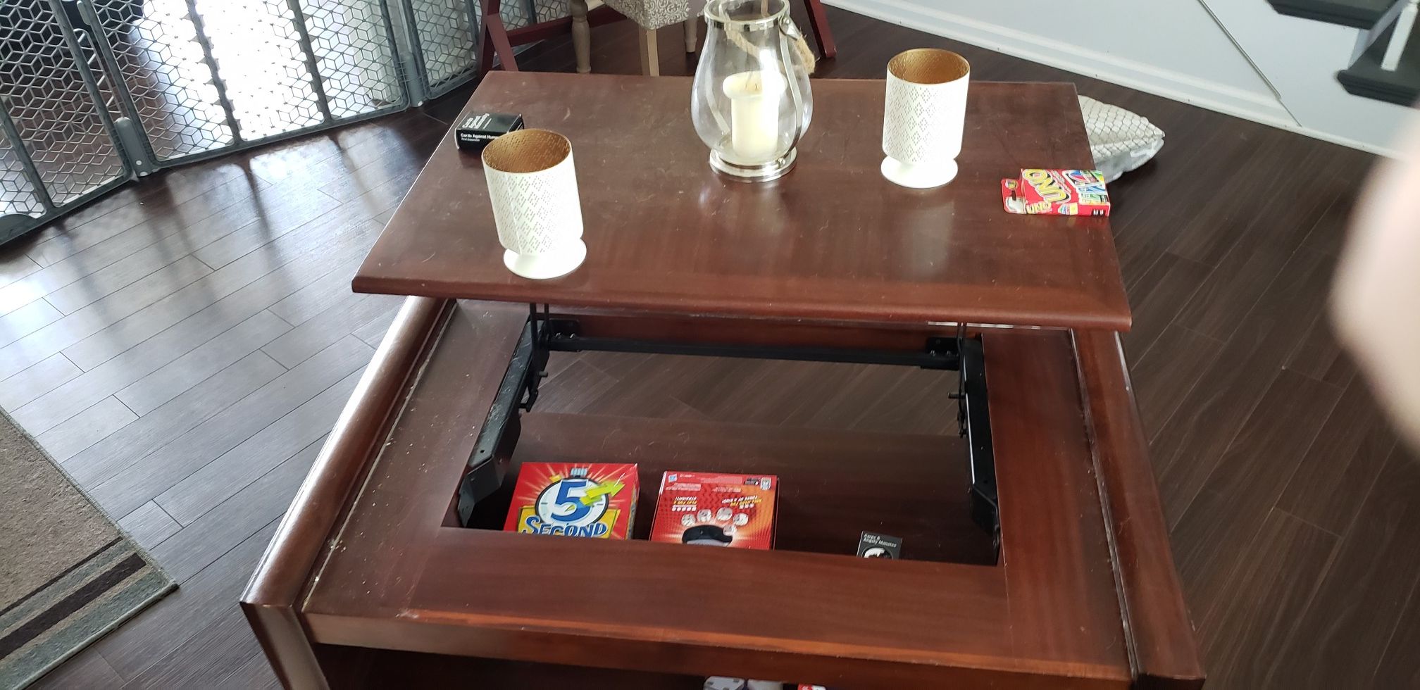 Coffee table with pull up top