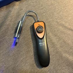Refrigerant gas leak sensor with ultraviolet flashlight. 