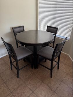 Tall wooden round table and chairs