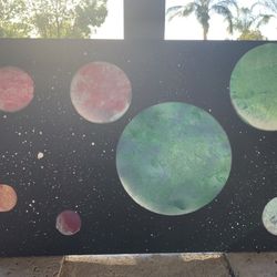 spray paint planet art on wood