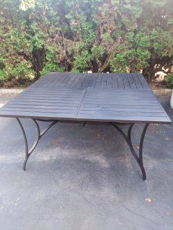 60" x 60" black metal outdoor table.