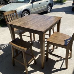 Wooden Kitchen Table With Teo Chairs And Teo Stools