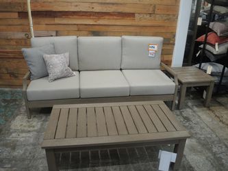 Weathered Wood Outdoor Sofa with Taupe Cushions