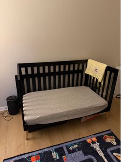 Delta Children Essex 4-in-1 Convertible Baby Crib, Ebony with Natural Legs