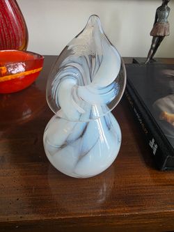 Hand-blown art glass vessel with white and blue swirled design