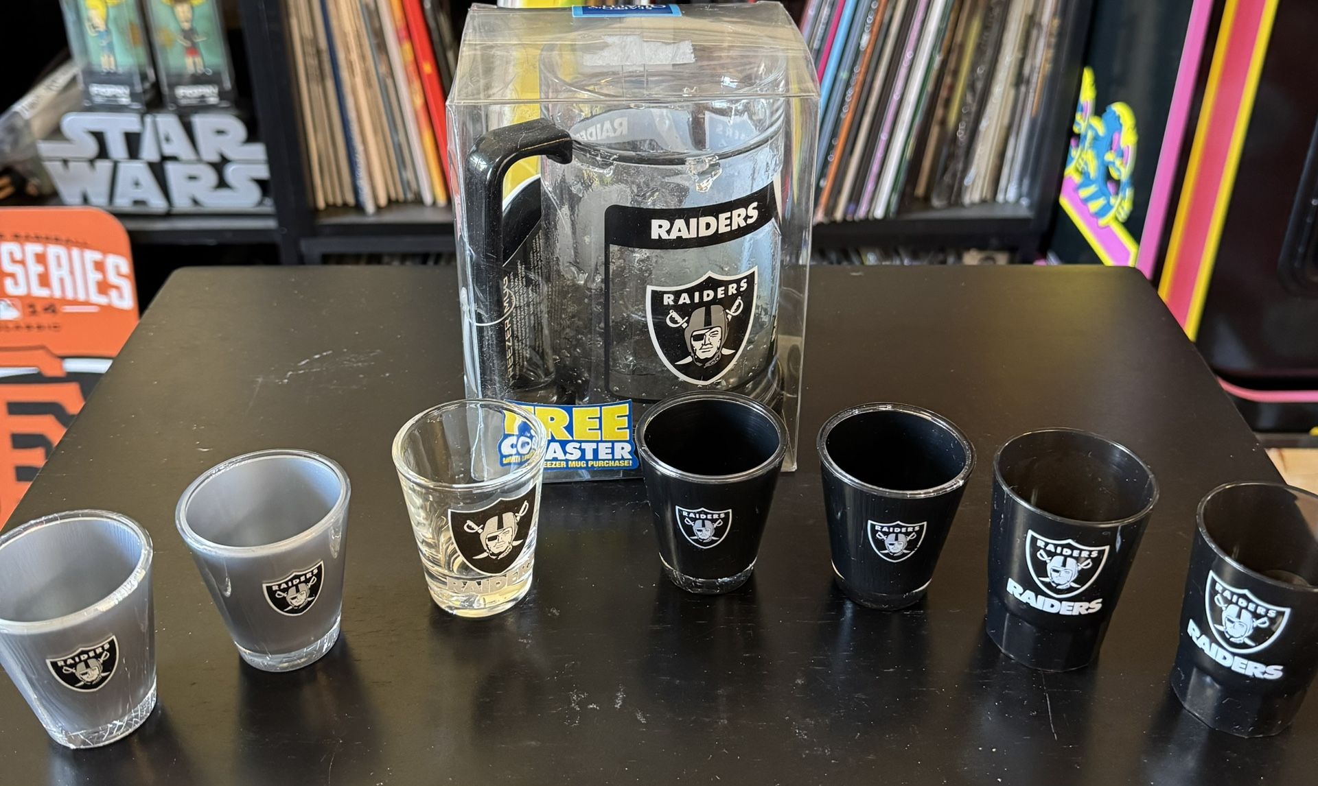 Oakland Raiders Bundle. Includes: Brand New Freezer Mug With Coaster. 7 Assorted Shot Glasses. Only $15.00 For All