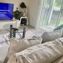Four-seat sofa with light linen-tone upholstery
