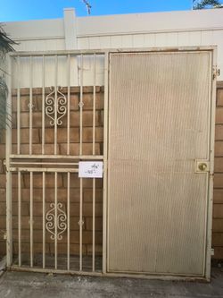 Metal security gate with door