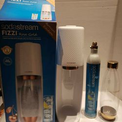 SodaStream rose gold edition with a gold 1 liter bottle barely used like new and 1 Canister selling for only $60