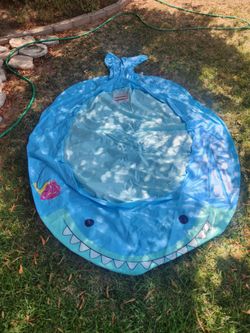 Approx 64 x 80" kids pool in good shape.....includes a 15 pack of toddlers SPLASHERS swim diapers