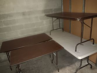 Selling 3 foldable wood tables and 1 white top plastic table