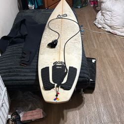 Lost Surfboard By Mayhem 6 Foot 8 Inches With A 2XL Full Body XCEL Wet Suit
