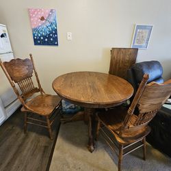 42" round Solid Oak table set - claw foot