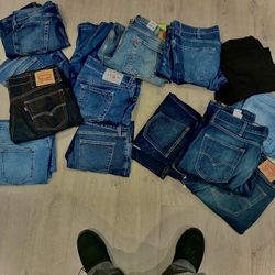 Multiple Pairs Of Jeans That Range From Multiple Sizes.