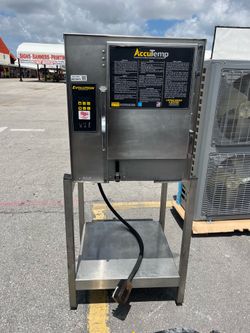 2018 AccuTemp Evolution Boiler-Free Commercial Steamer on stainless stand. 208V Single Phase unit. Powered on successfully. Unit displayed low water n