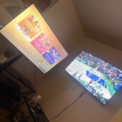 Two 50 Inch Smart TVs And Tv Stand