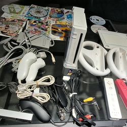 “Nintendo Wii Console Bundle with Controllers, Cables, Wheels, and Games”