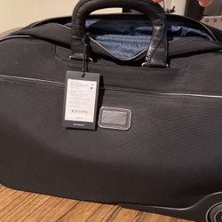 Tumi’ Traveling Wheeled Duffel Bag- Brand New!