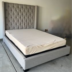Gray Queen bed and dresser