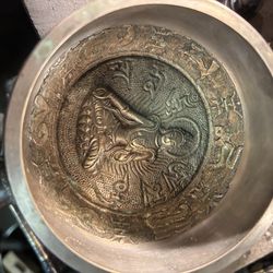 Brass Buddha  in a bowl