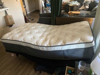 Almost new twin adjustable bed with massage base