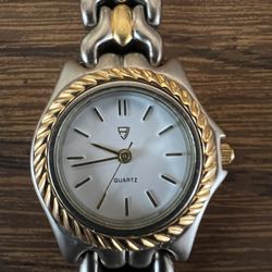 Alexander Julian Lady’s silver & gold tone watch, round face, needs battery 
