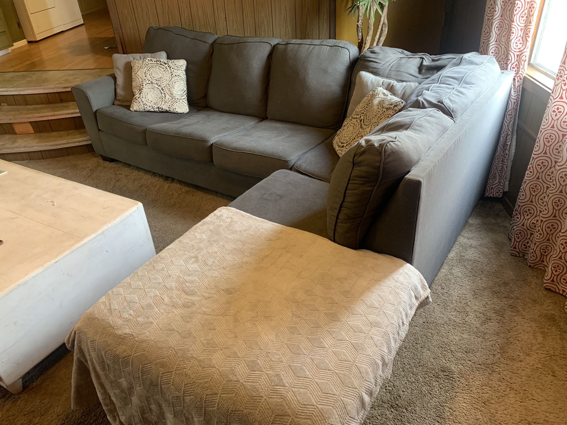 Grey cloth sectional couch