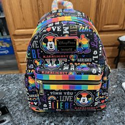 Disney Loungefly Loungefly Mickey Pride Mini Backpack.  The backpack is 10 inches tall and 9 inches wide.  Brand new with tags .  