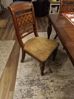 Dark Wood Dining Table with Carved Legs and hutch/China cabinet from Ashley's