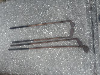 Antique wooden handle golf clubs