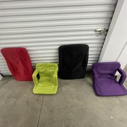 Set of 4 foldable backpack stadium chairs.