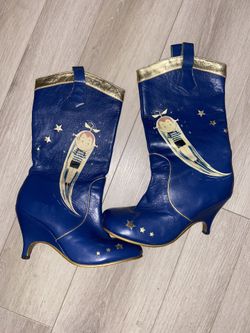 Vintage Irregular Choice boot with a unique blue and gold design in a flying character and stars. 